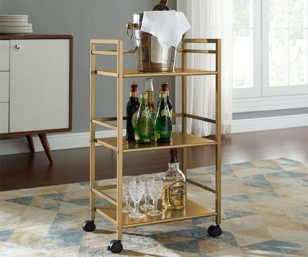 wayfair gold wine cart in a living room