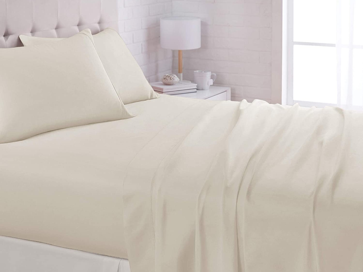 beige sheets on queen-sized bed