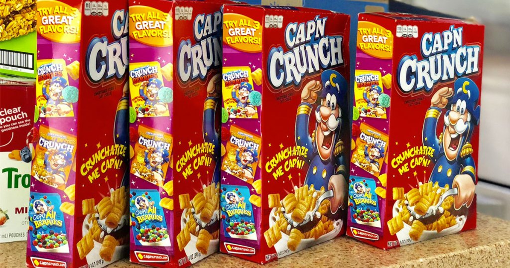 four red boxes of capn crunch cereal on kitchen counter