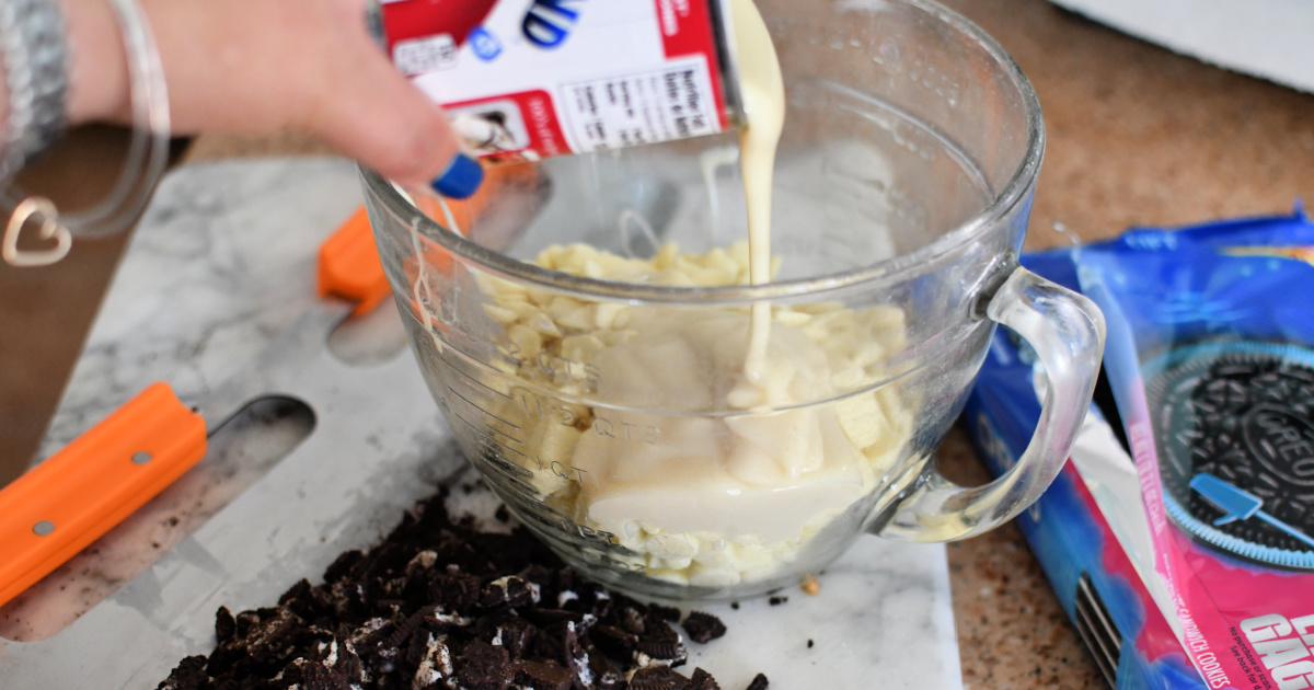 pouring sweetened condensed milk into bowl