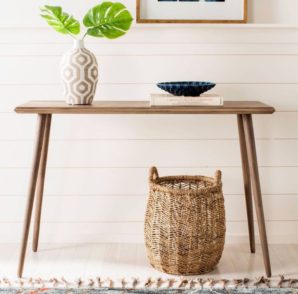 console table w/ plant on it