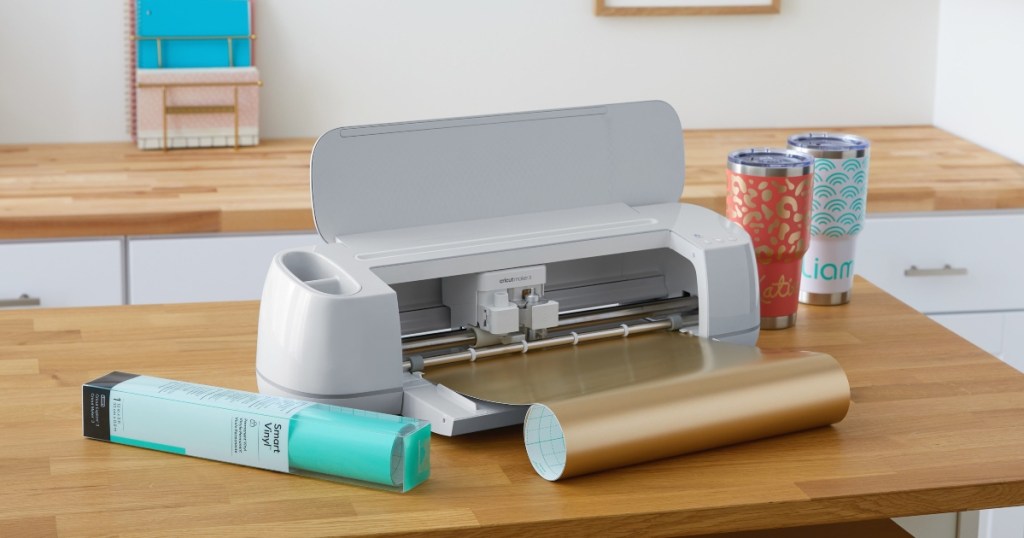 Cricut Maker 3 with tumblers and vinyl rolls