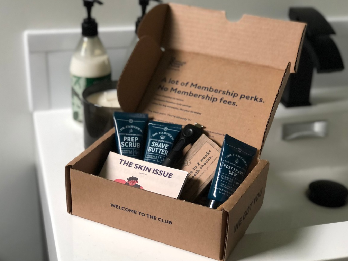 box on bathroom counter with shaving supplies is one of our easy college care package ideas