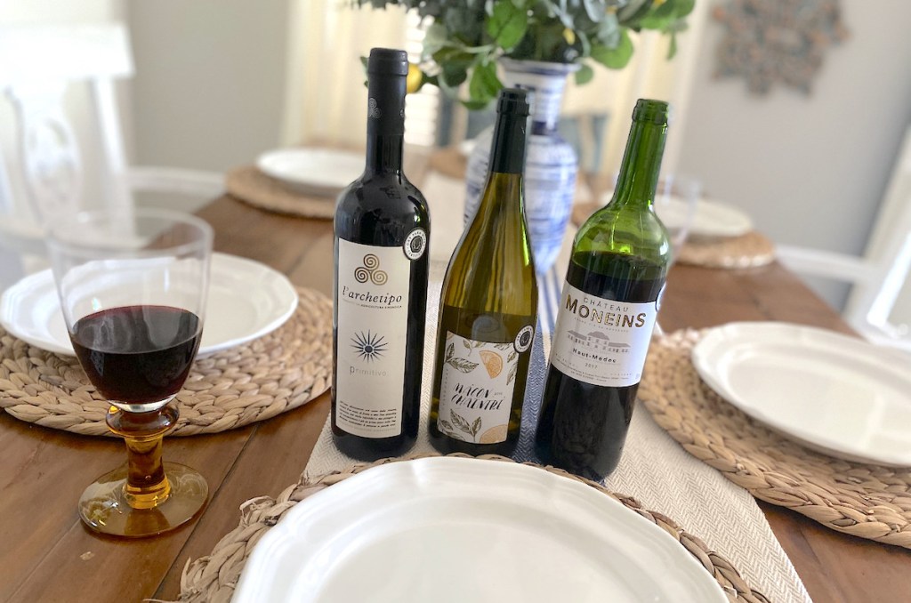 three bottles of wine on dining room table