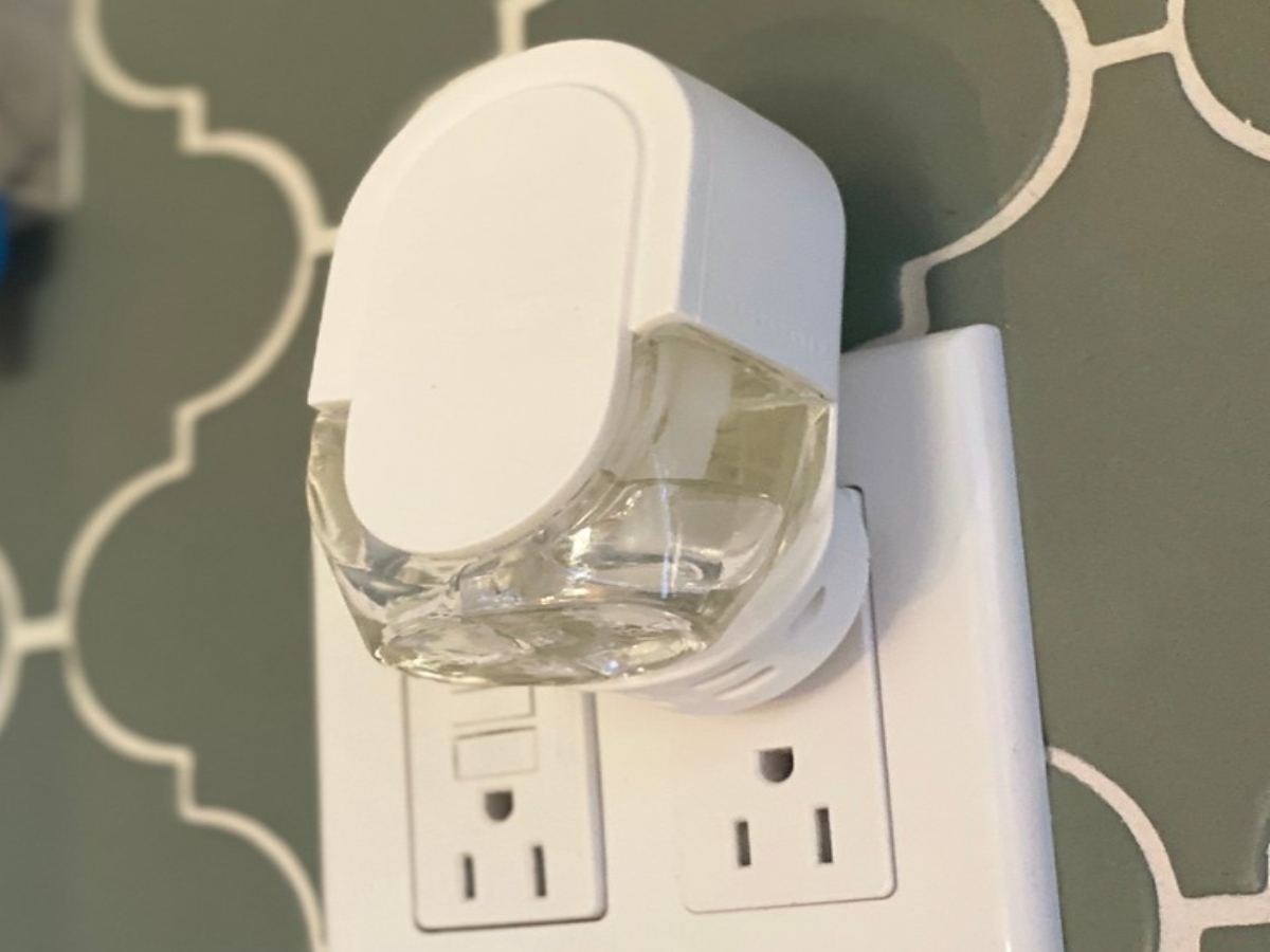 febreze plugin pugged into outlet on the wall