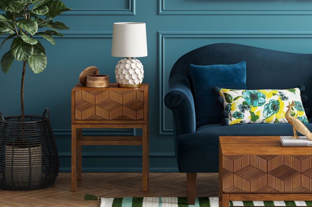 geometric accent table near teal wall