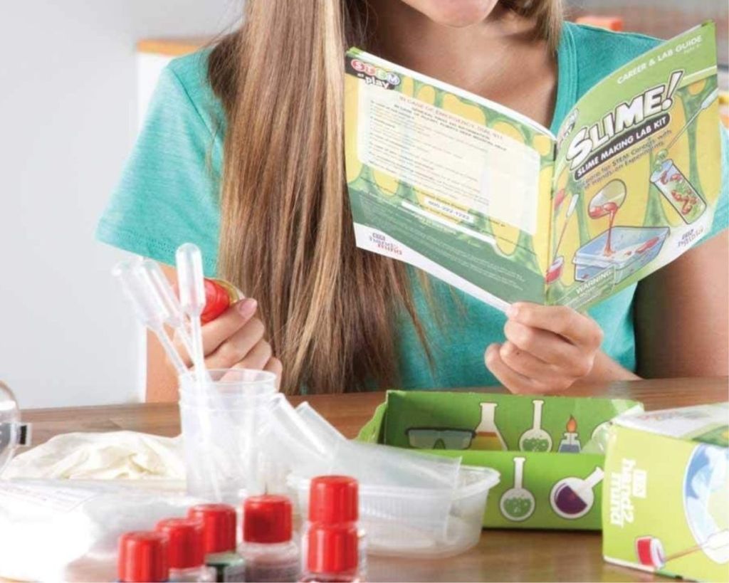 child playing with hand2mind slime making kit