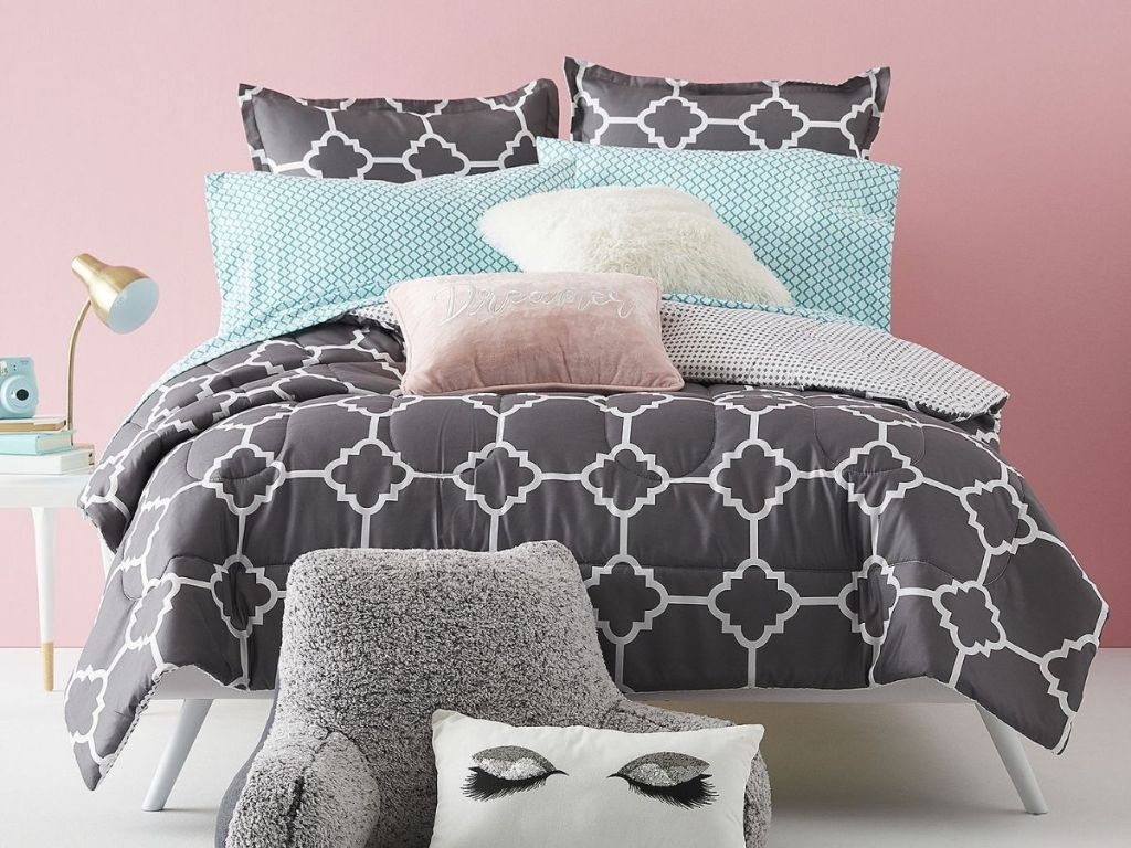 gray and white comforter on bed set