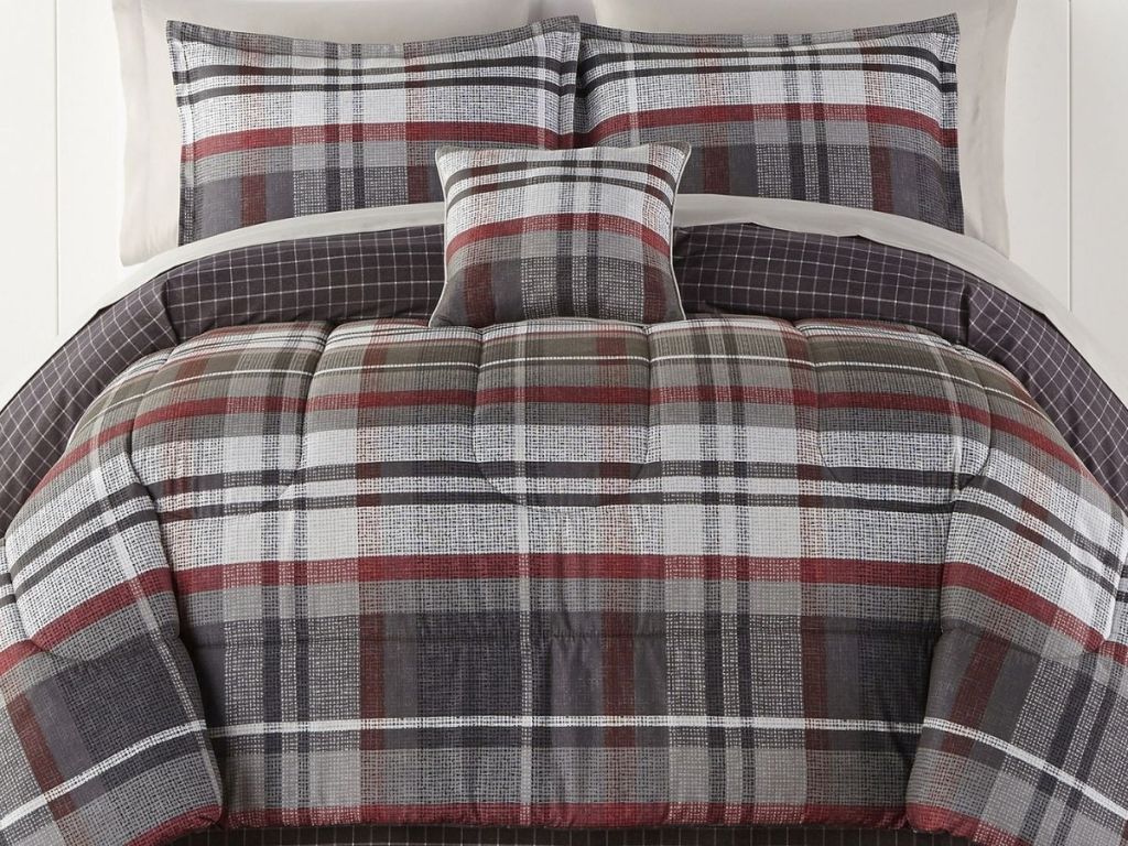 plaid comforter and sheet set on bed