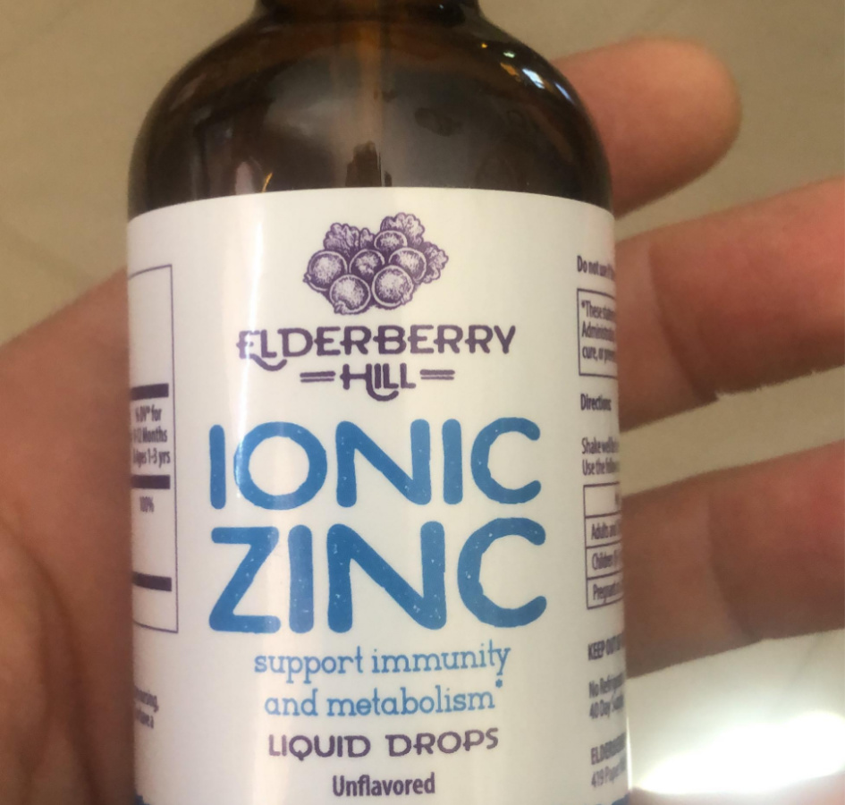 hand holding Elderberry Ionic Zinc drops