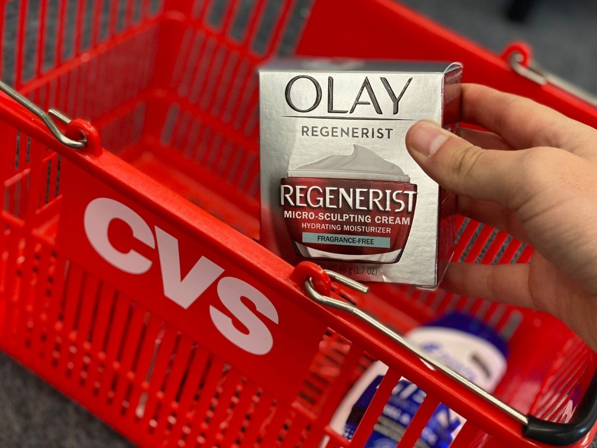 hand taking out Olay Regenerist from CVS basket