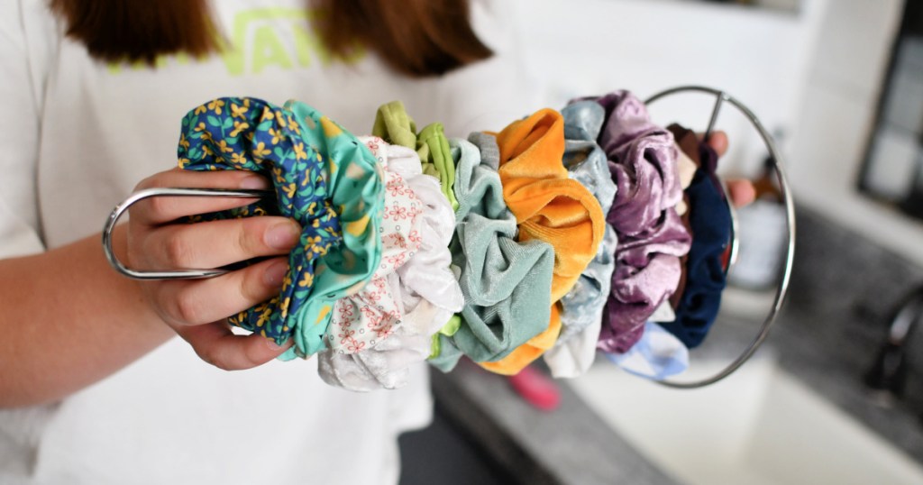 organizing scrunchies on a paper towel holder