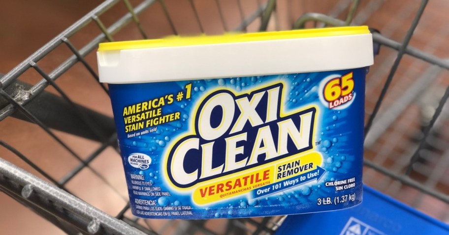 blue tub of Oxi Clean Stain remover in store cart