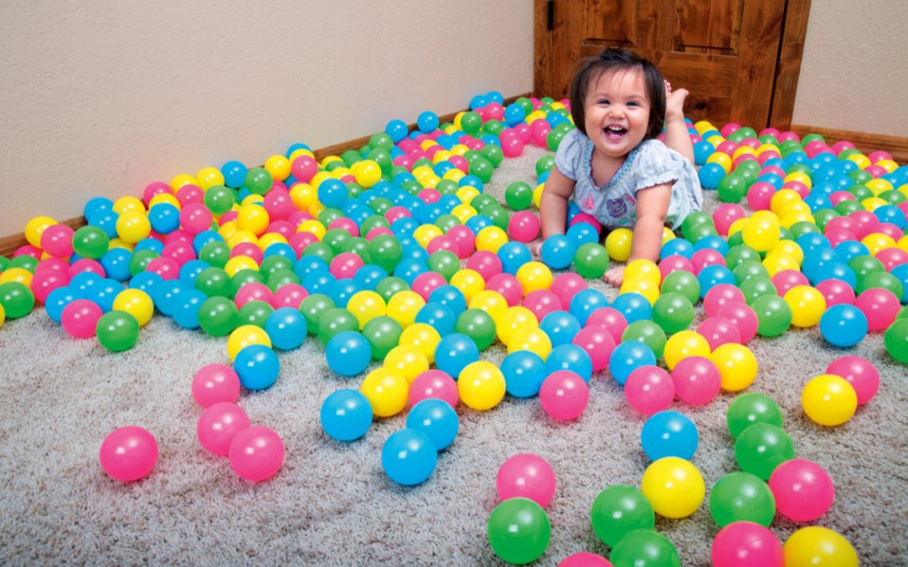 baby with plastic balls