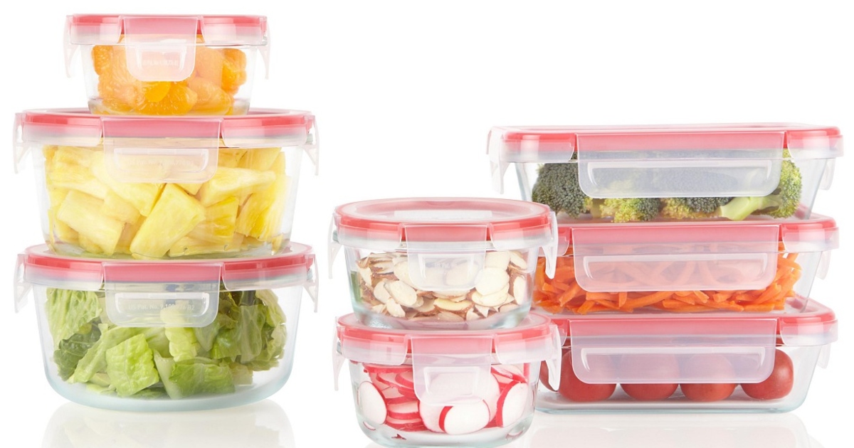 Full pyrex food storage set with lids on. filled with food items and stacked up