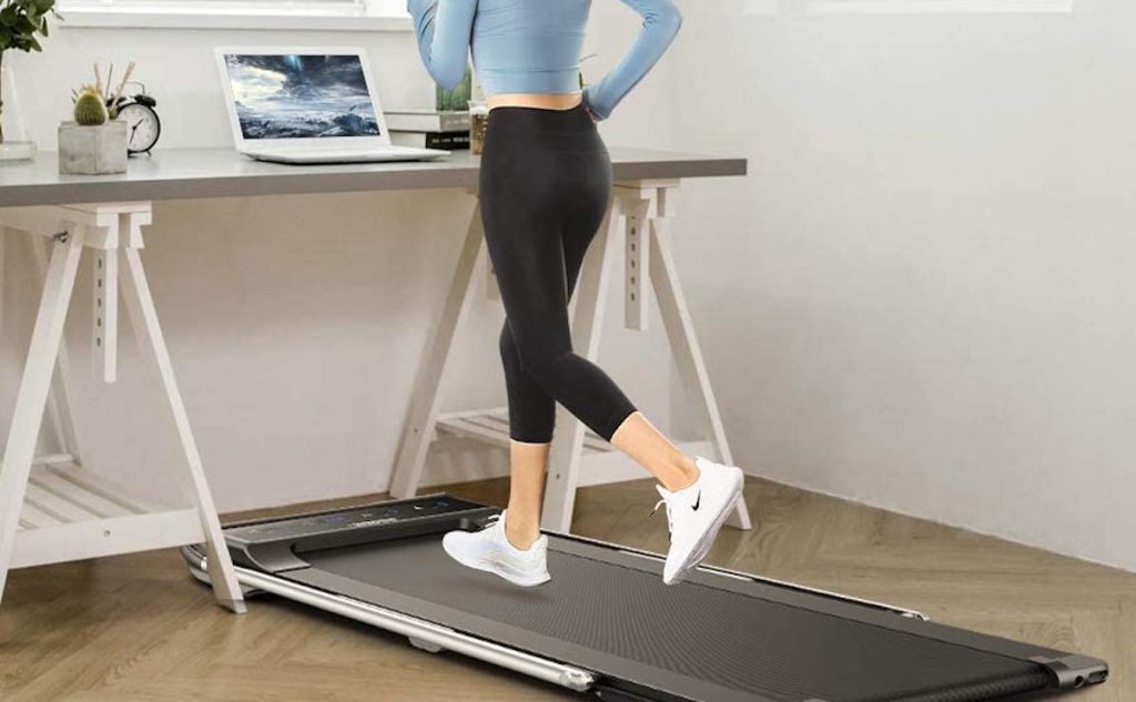 woman running on under desk treadmill 