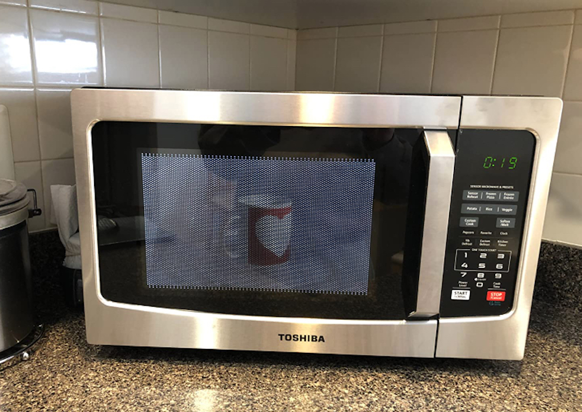stainless steel countertop microwave sitting on kitchen counter