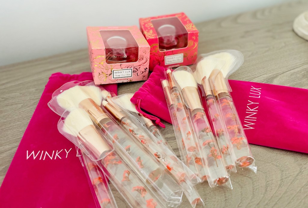 two sets of winky lux floral makeup brushes and boxed rose cheeky blush