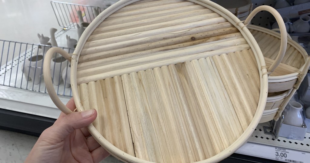 wooden round tray in hand in store at target