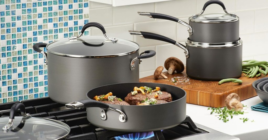 cookware set on stove and kitchen counter