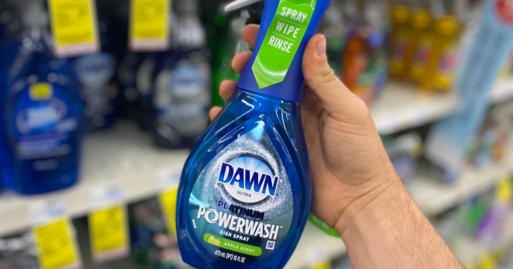 hand holding blue bottle of dish spray