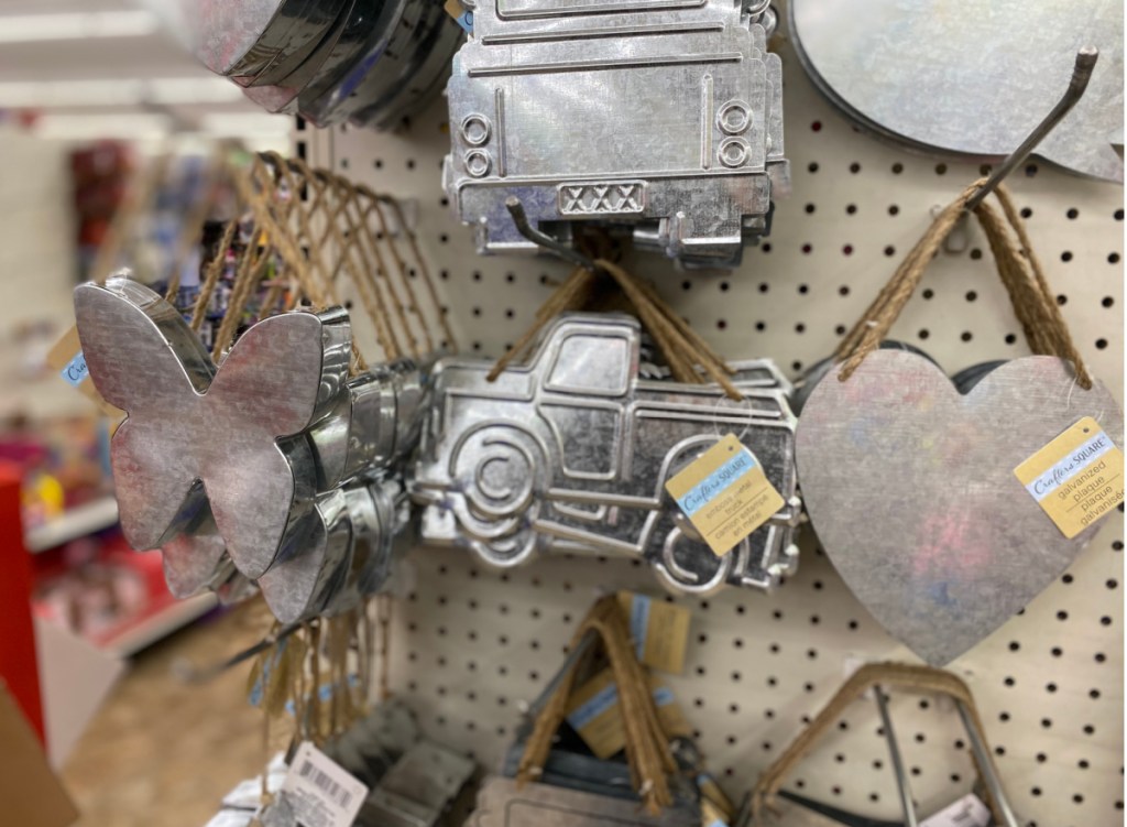 metal hanging signs shaped like trucks