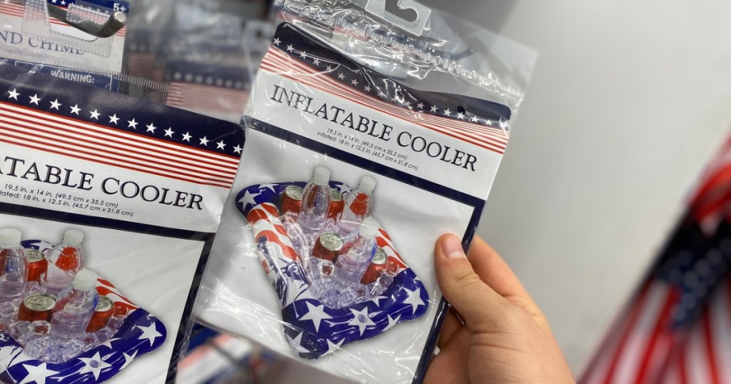 Hand holding out a Dollar Tree Patriotic Cooler