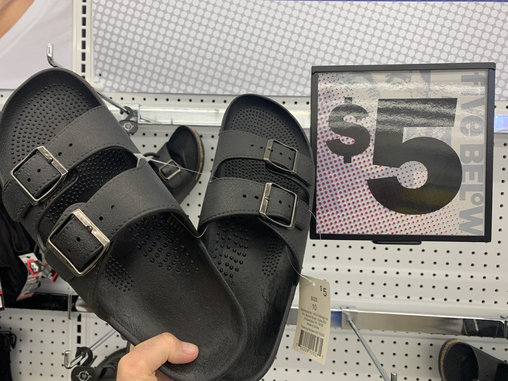 hand holding up a pair of slides 