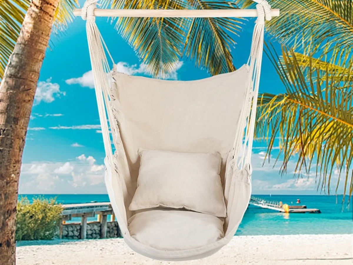 beige color hanging lounge chair in front of a fake tropical island background