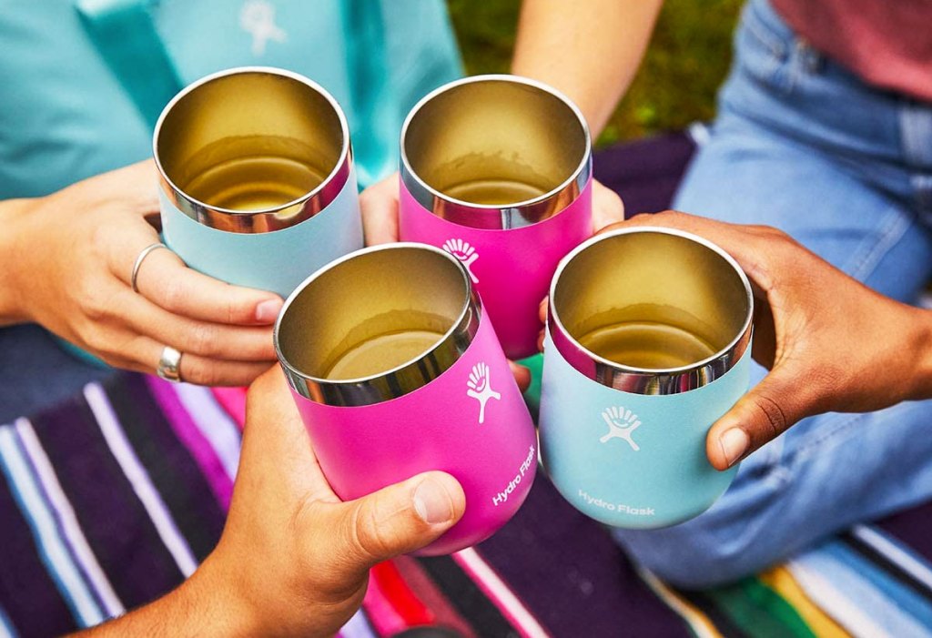 people holding up hydro flask wine tumblers