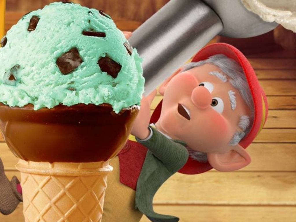 Keebler elf next to huge chocolate dipped ice cream cone