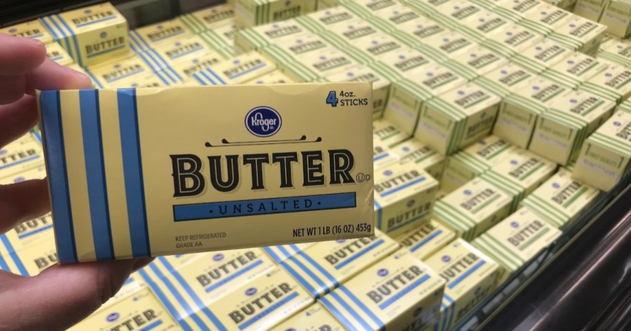 holding a pound of butter sticks at Kroger