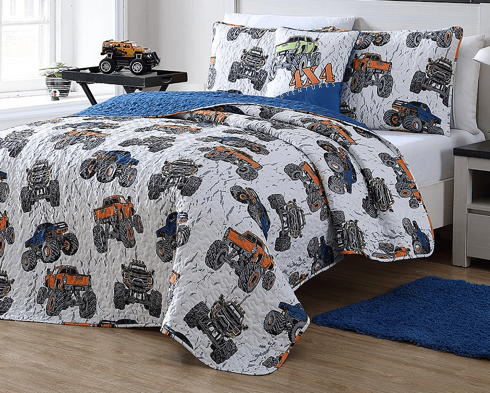 bed with monster truck bedding on it
