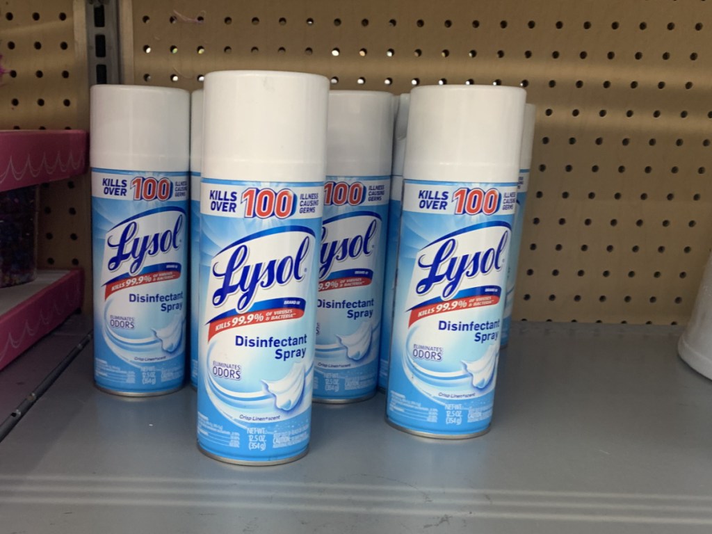 Four canisters of Lysol disinfectant spray on clearance