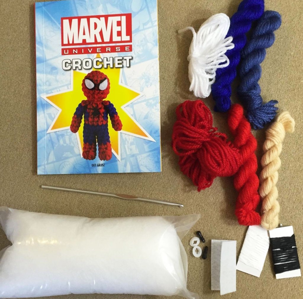 marvel crochet booklet, yarn, and supplies