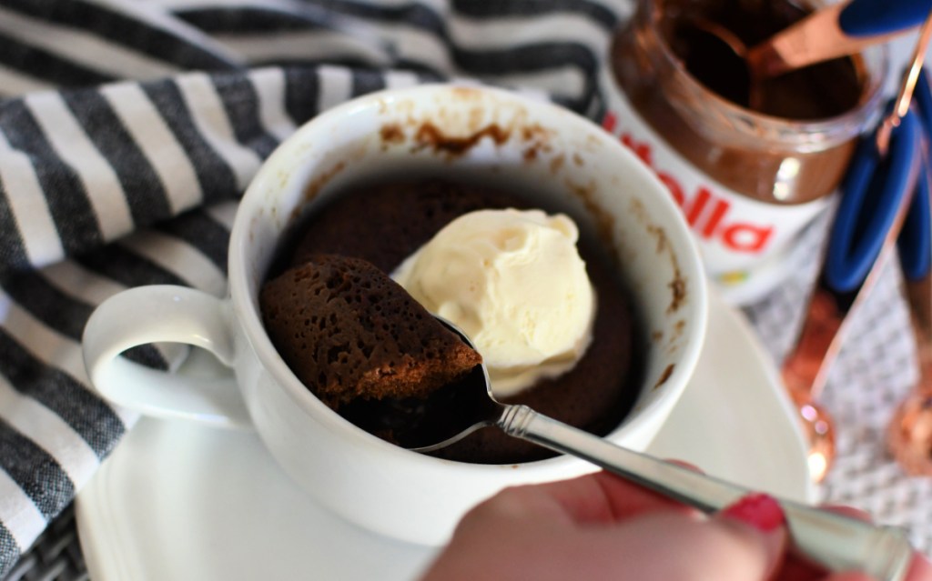 a scoop of nutella mug cake