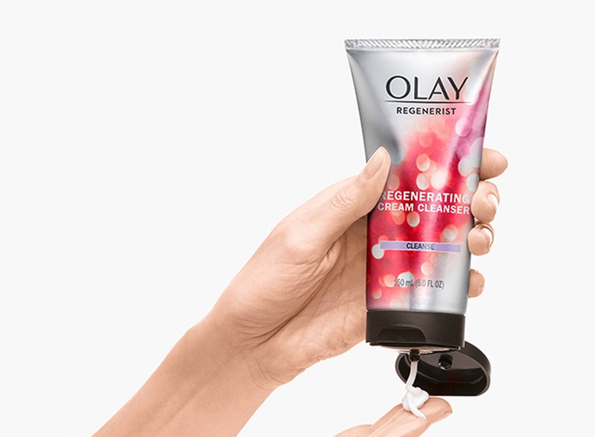 hand holding an Olay Regenerist Cream Cleanser