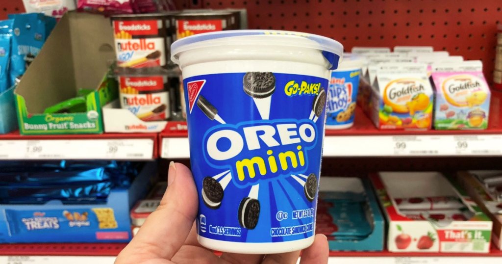 person holding up oreo mini go-pack cup