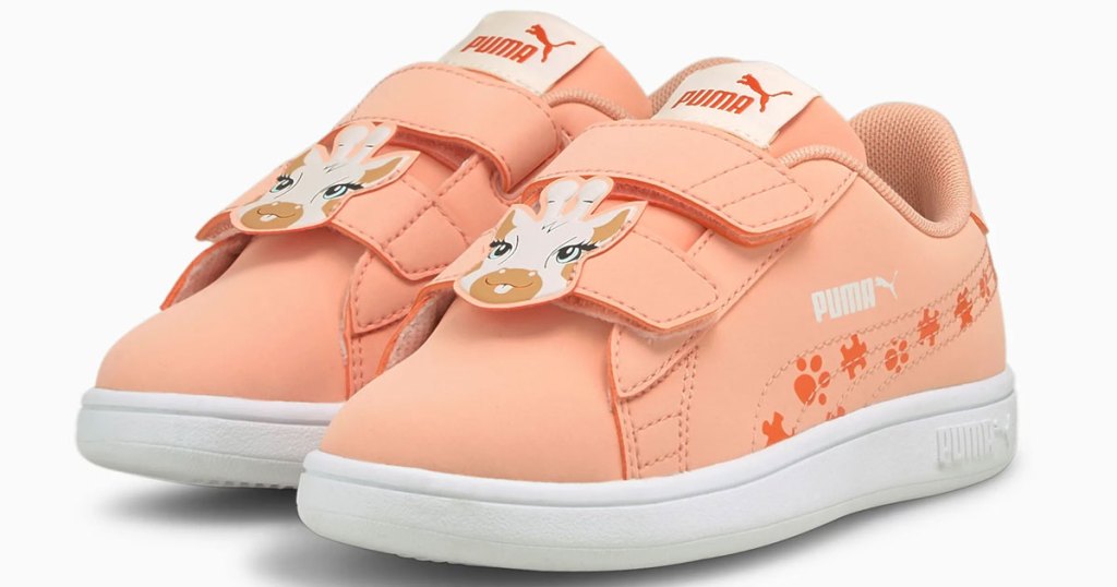 pair of pink puma sneakers with giraffes