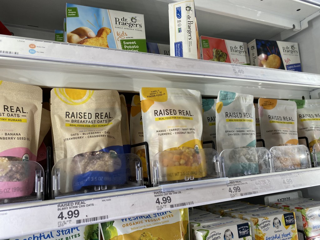 Raised Real Foods in cooler shelves at store