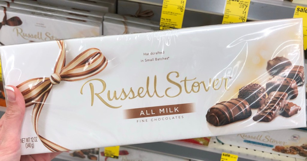 hand holding box of russell stover chocolates