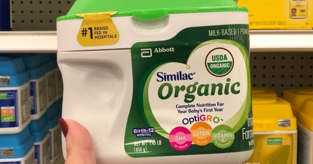 hand holding a container of Similac organic formula