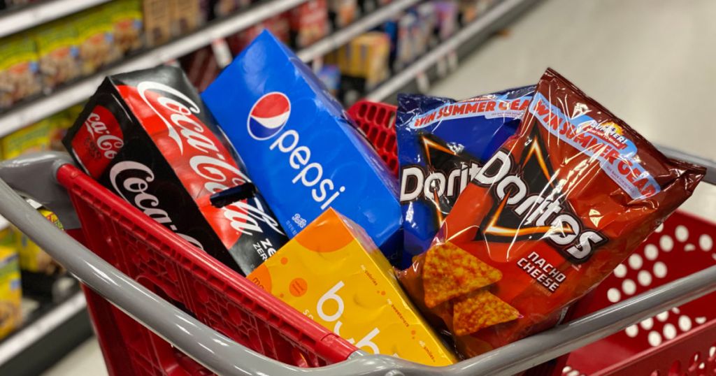 soda, sparkling water and chips in cart 