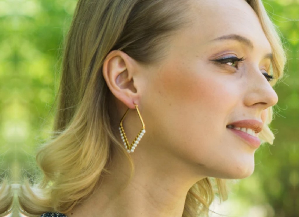 woman wearing old hoop earrings