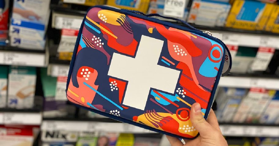 hand holding travel first aid bag in store