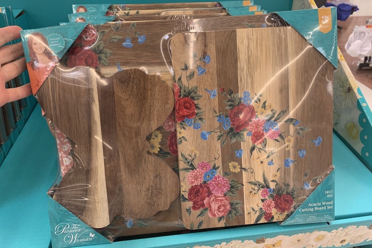hand showing The Pioneer Woman 3-pc cutting board set