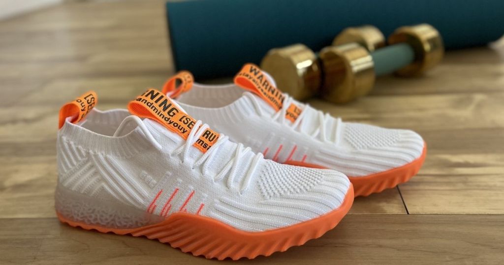 white and orange sneakers