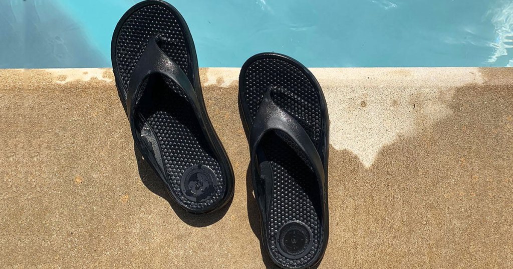 Totes Women's Thong Sandals near pool