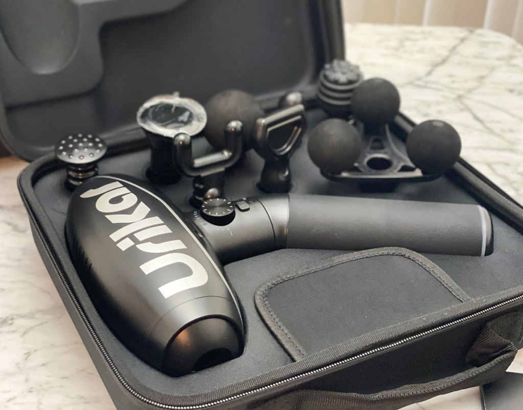 massage gun and attachments in carrying case