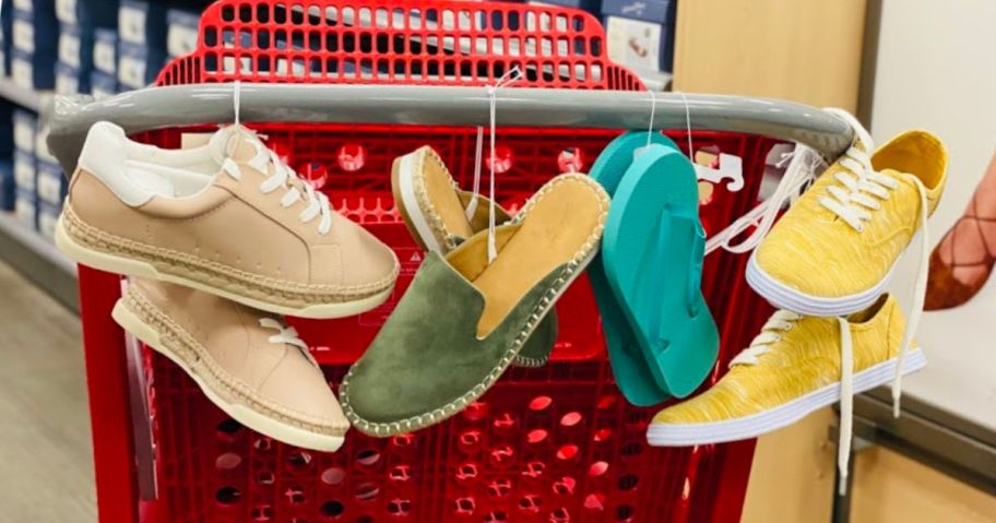 shoes hanging from red basket